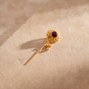 Daboos (D63) scarf pin on travertine stone