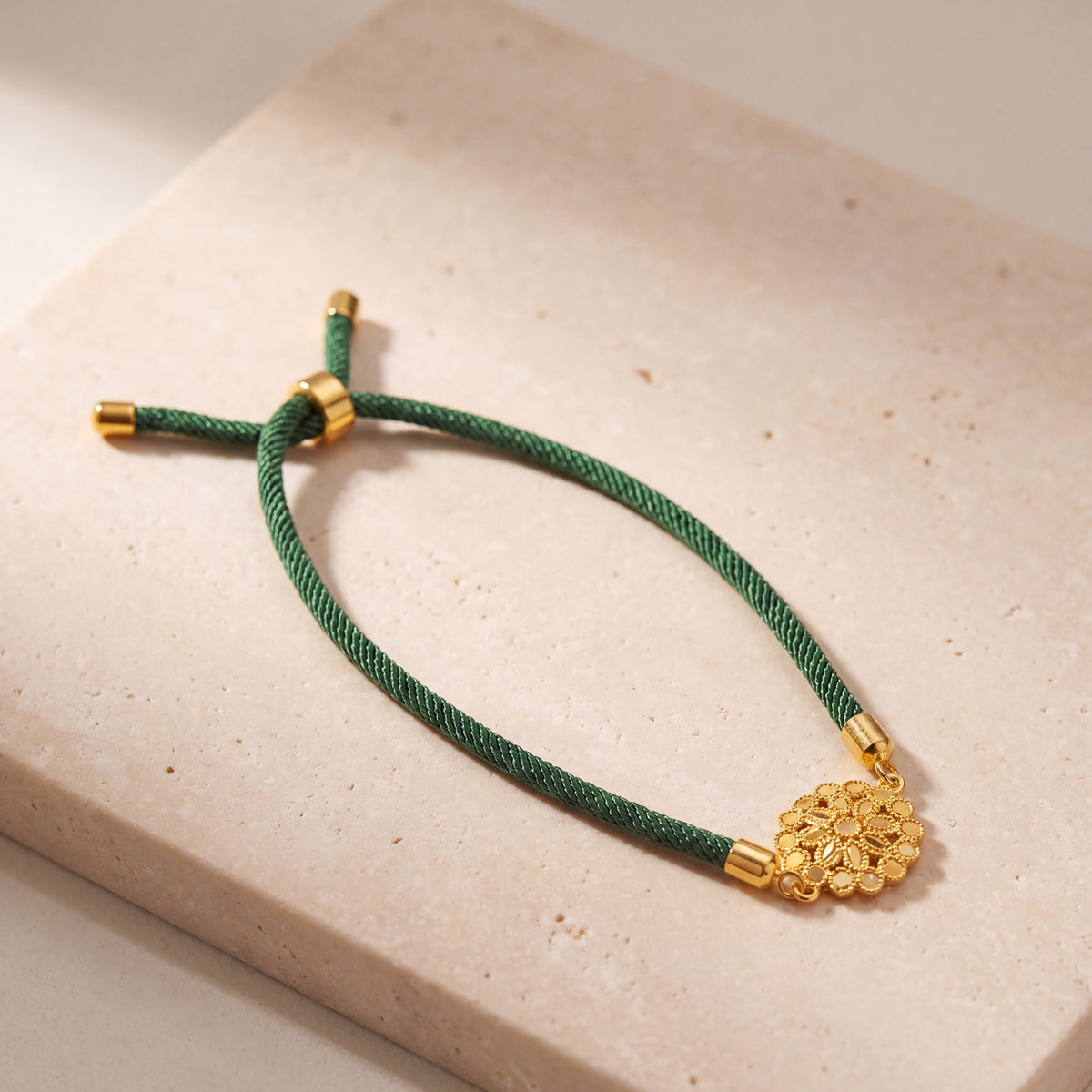 Dahlia Thread Bracelet on travertine