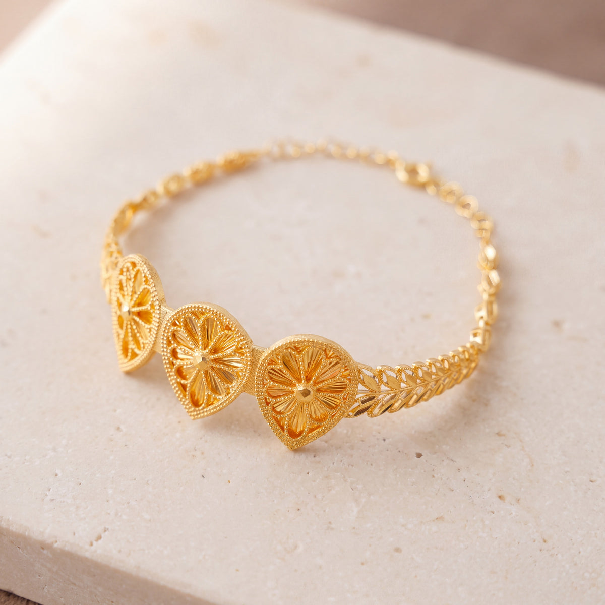 Diamond Cut Drop Cuff Bracelet (D1) on travertine