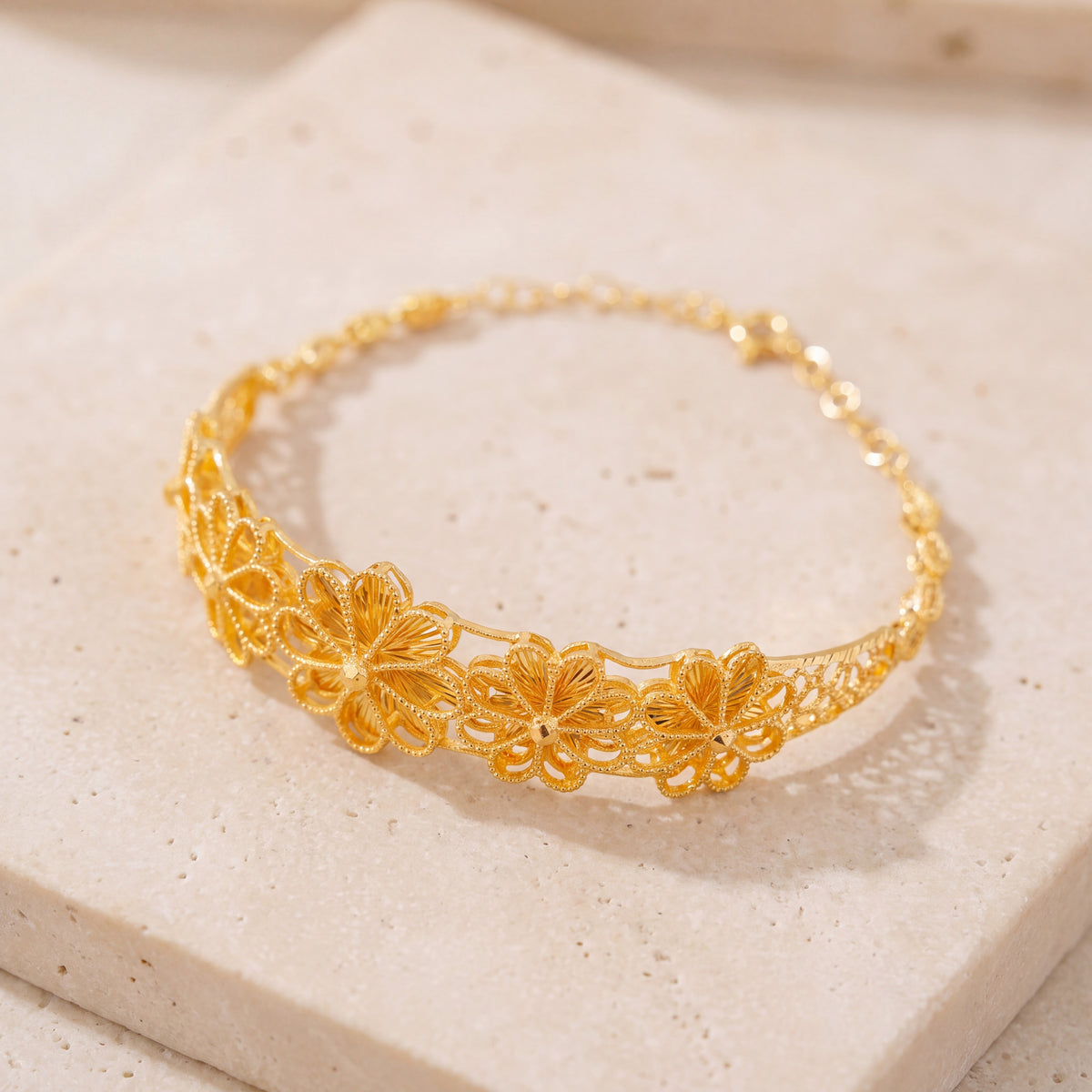 Diamond Cut Flower Cuff Bracelet (D1) on travertine
