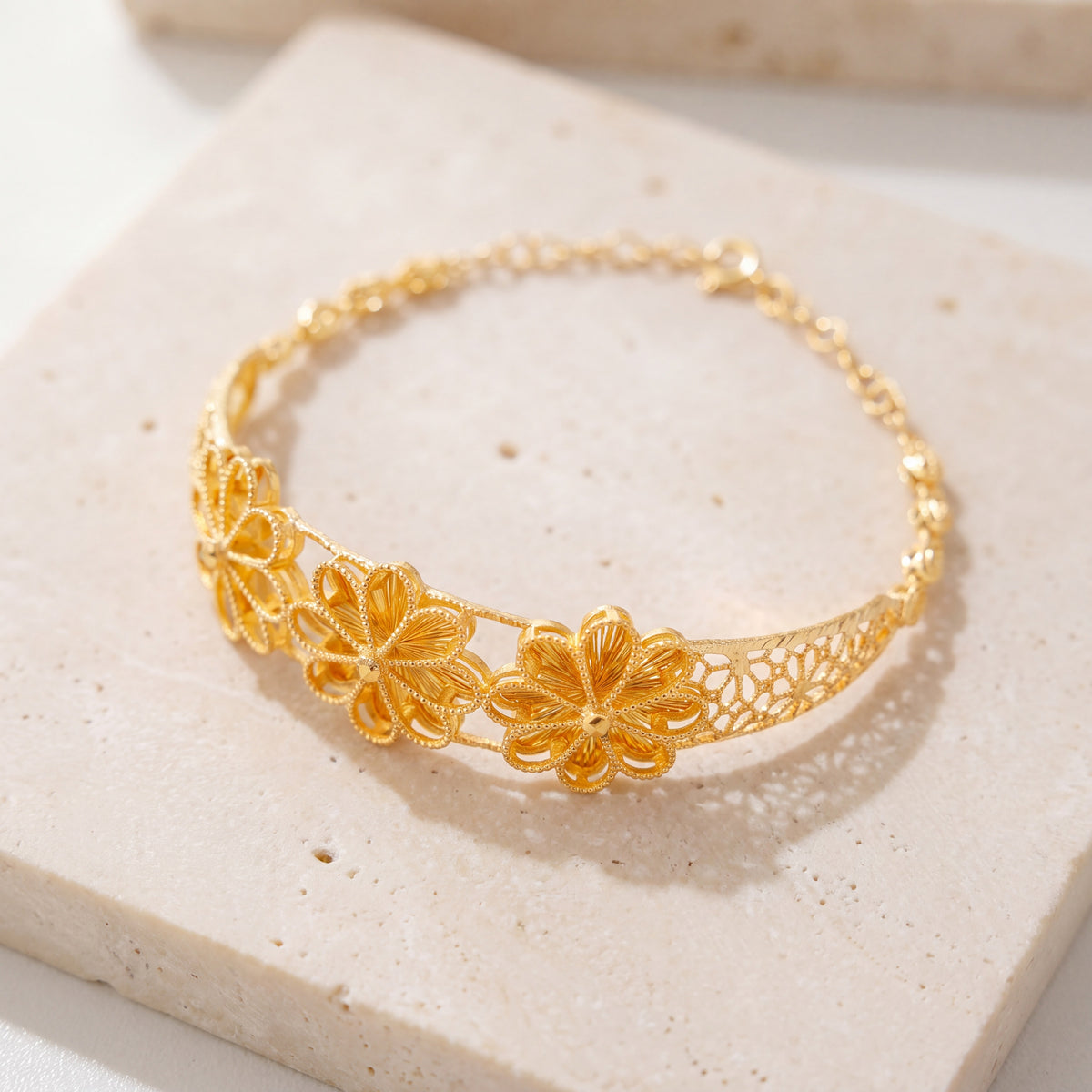 Diamond Cut Flower Cuff Bracelet (D2) on travertine