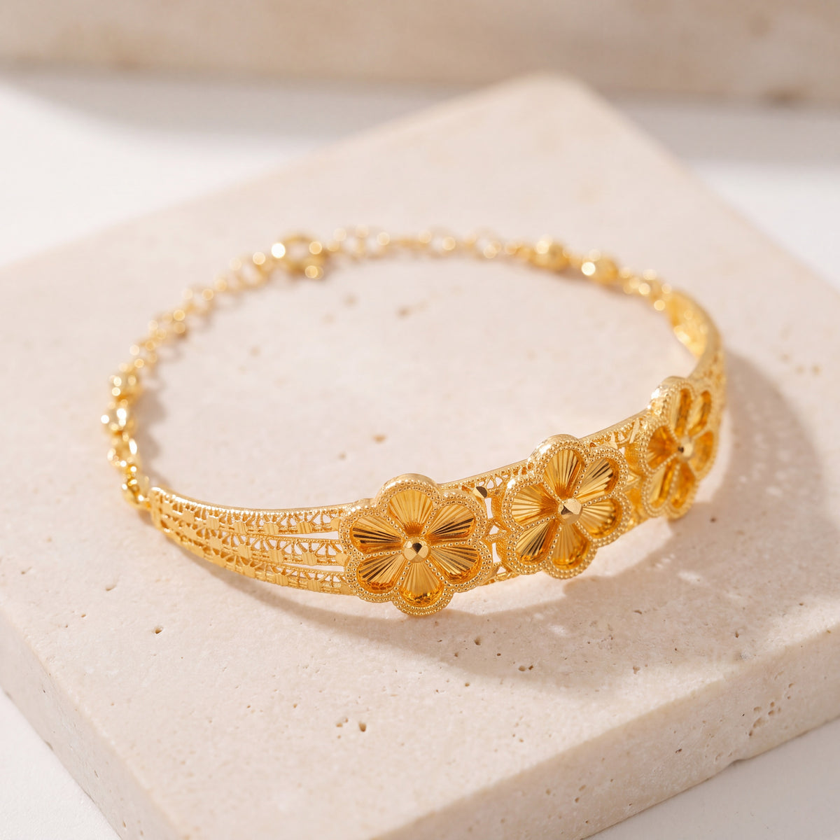 Diamond Cut Flower Cuff Bracelet (D4) on travertine