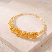 Diamond Cut Flower Cuff Bracelet (D7) on travertine