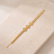 Diamond Cut Oval Bracelet (D1) on travertine