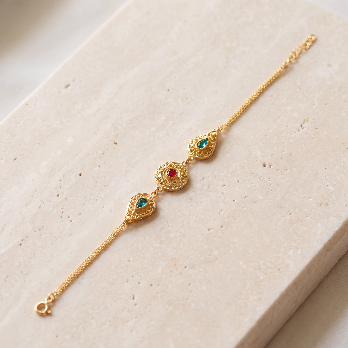 Drop Shape Stone Bracelet (D1) on travertine
