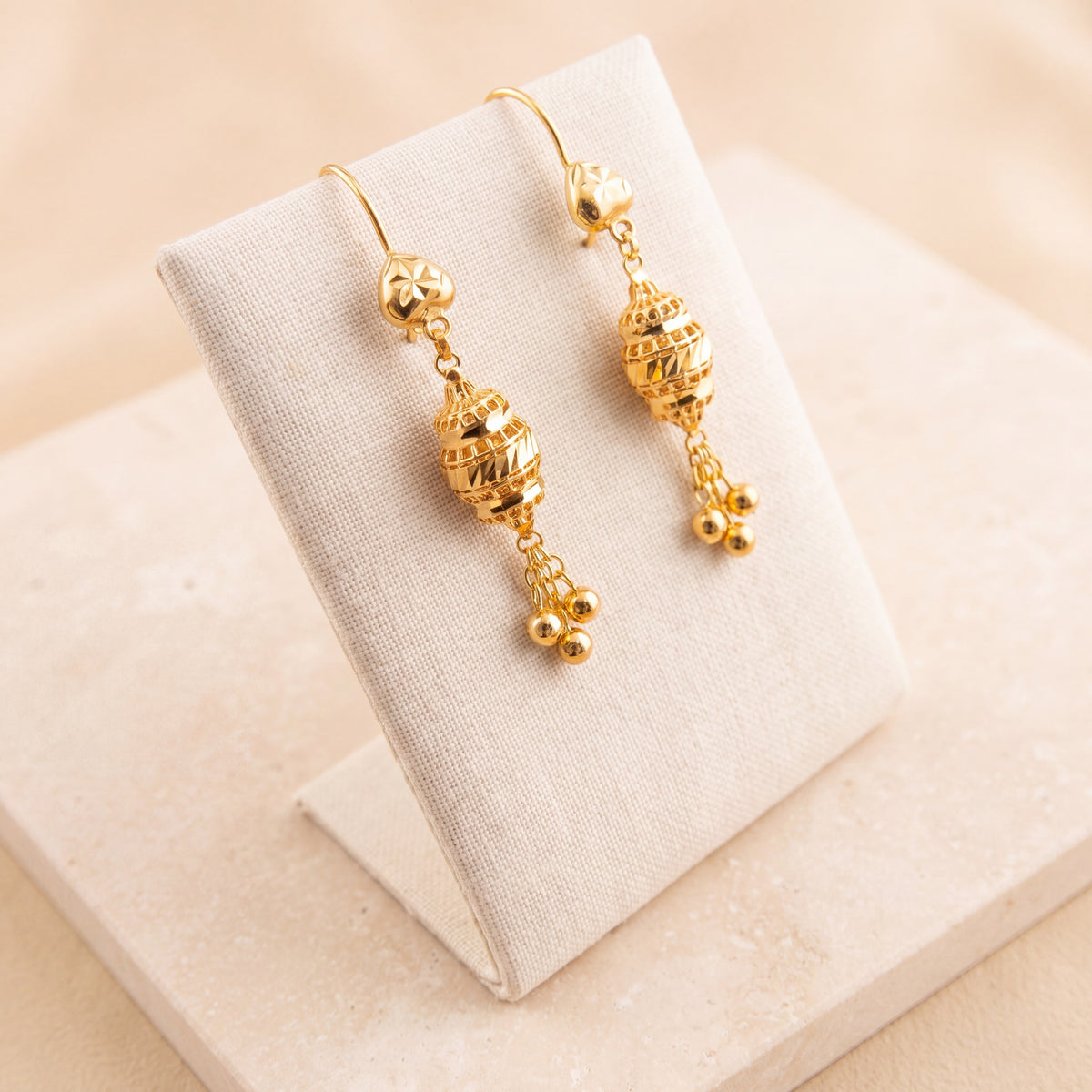 Barrel Earrings 34 on travertine