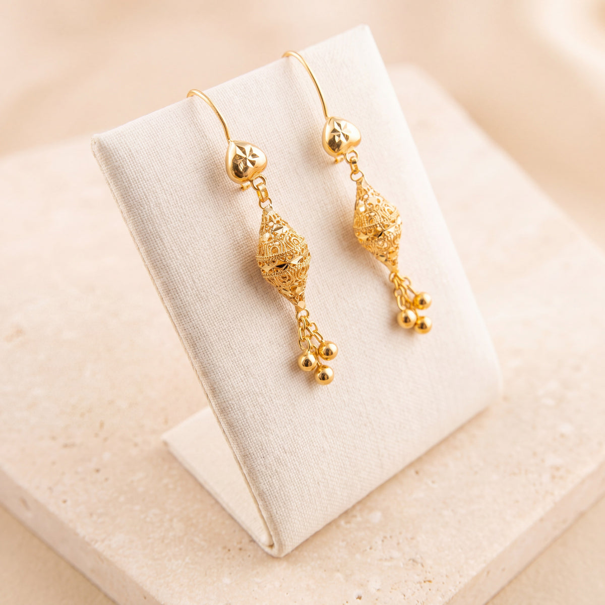 Barrel Earrings 37 on travertine