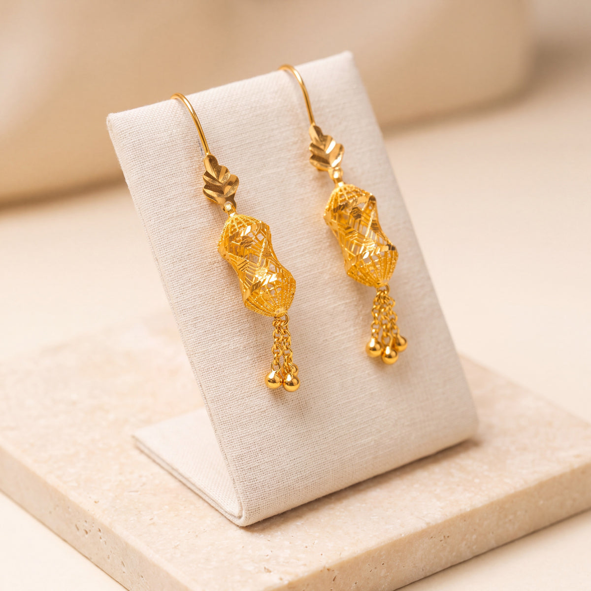 Barrel Shaped Earrings (D6) on travertine