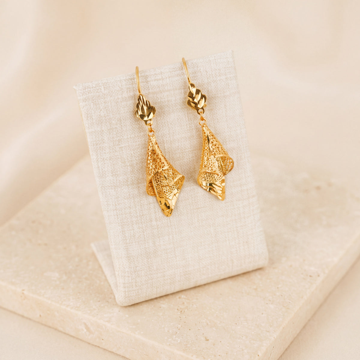 Casting Earrings (D30) on travertine