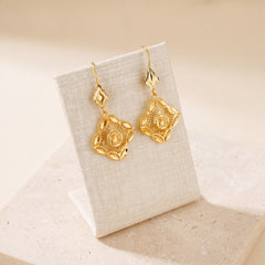 Casting Earrings (D32) on travertine