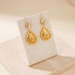 Casting Earrings (D38) on travertine