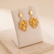 Casting Earrings (D65) on travertine