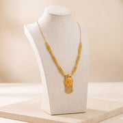 Casting Mala Necklace 12 on travertine