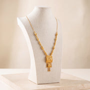 Casting Mala Necklace 16 on travertine