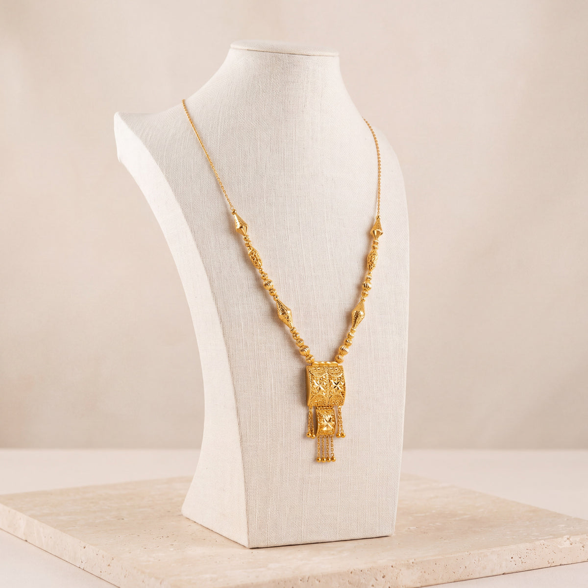 Casting Mala Necklace 20 on travertine
