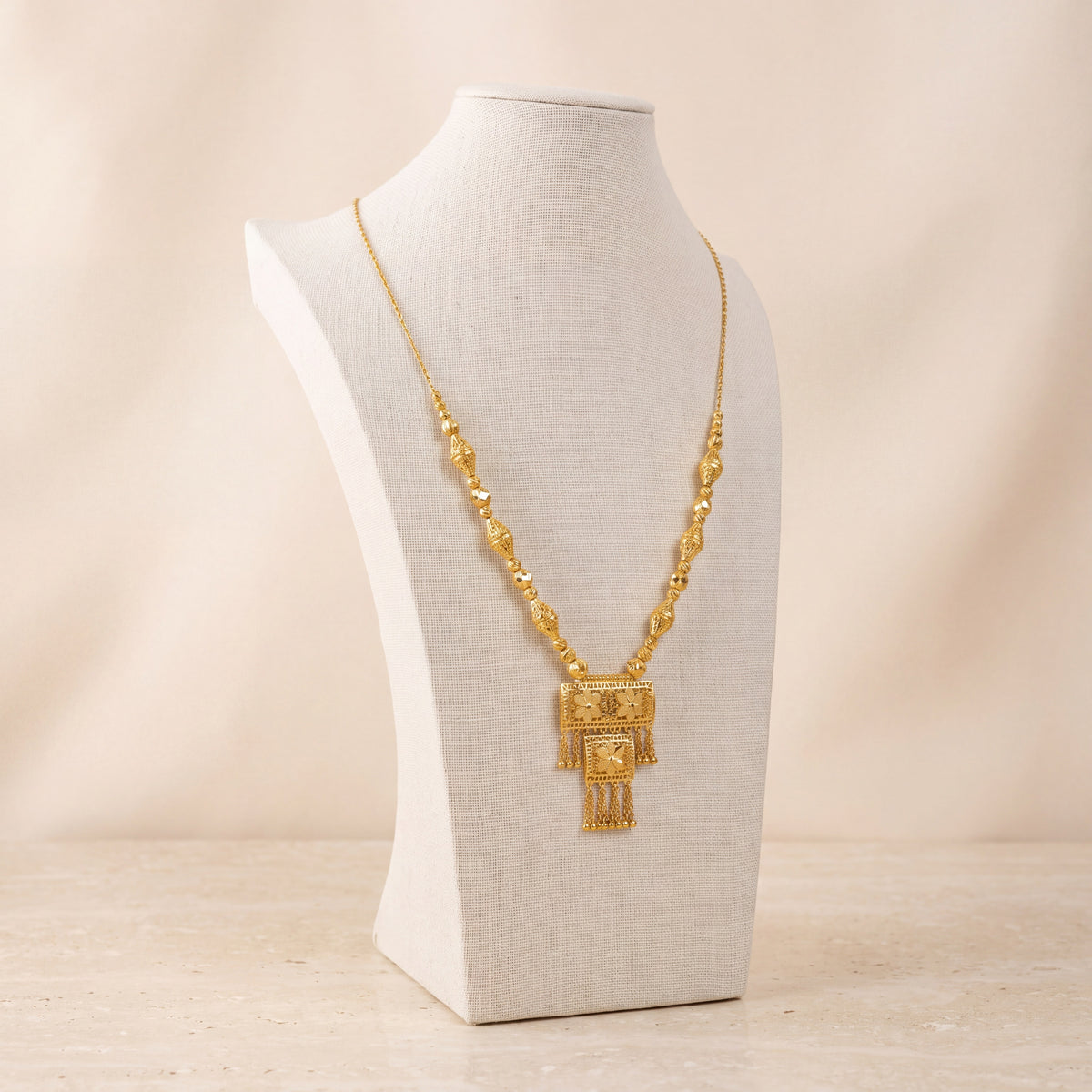 Casting Mala Necklace 24 on travertine