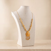 Casting Mala Necklace 33 on travertine