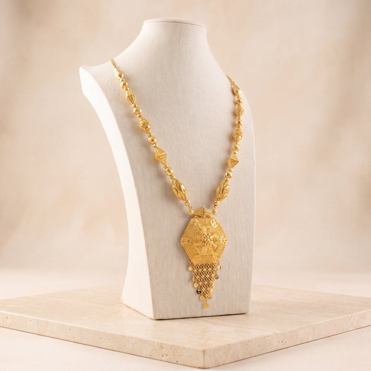 Casting Mala Necklace 65 on travertine