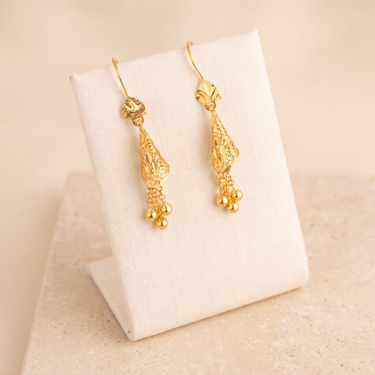 Cone Earrings 1 on travertine