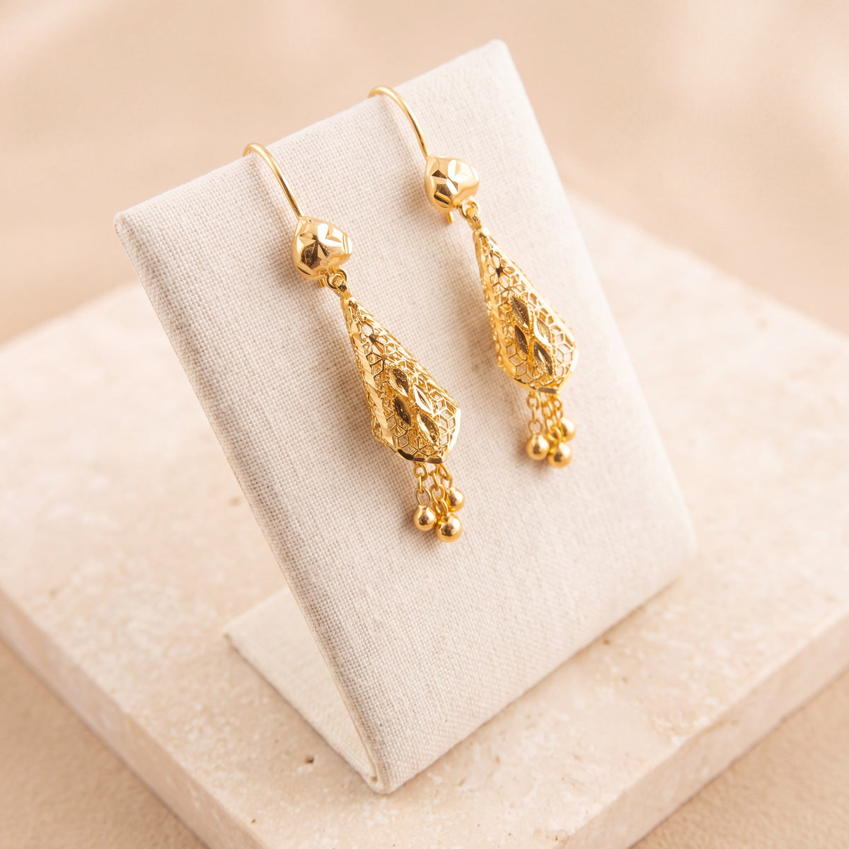 Cone Earrings 3 on travertine