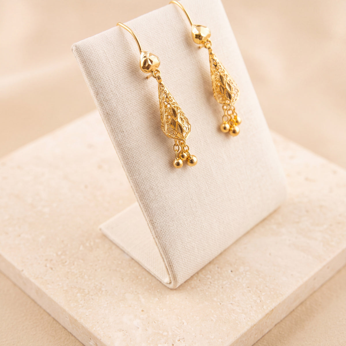 Cone Earrings 4 on travertine