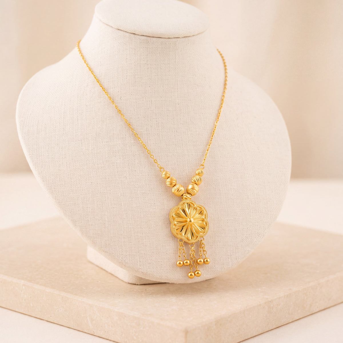 Diamond Cut Clover Mala Necklace 1 on travertine