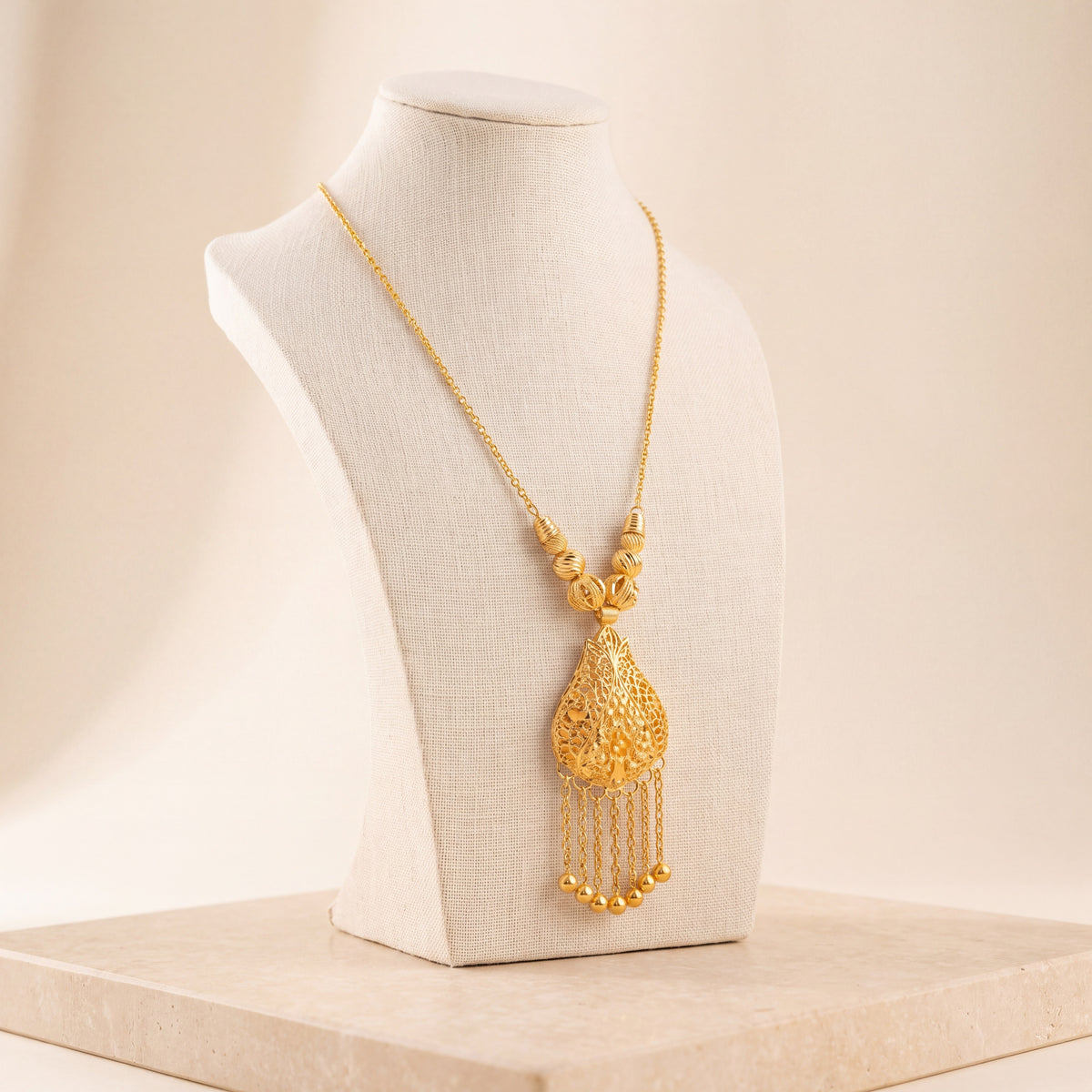 Diamond Cut Drop Mala Necklace 2 on travertine