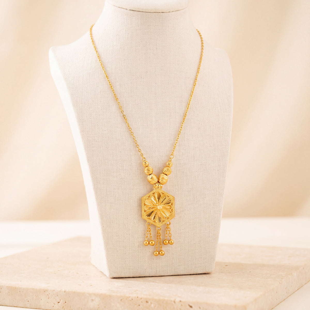 Diamond Cut Hexa Mala Necklace 1 on travertine