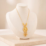 Diamond Cut Oval Mala Necklace 1 on travertine
