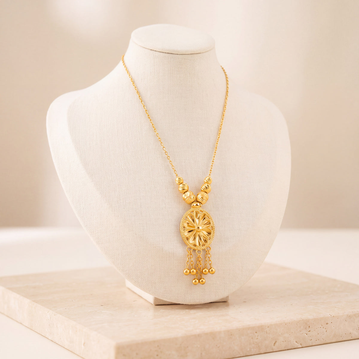 Diamond Cut Oval Mala Necklace 1 on travertine