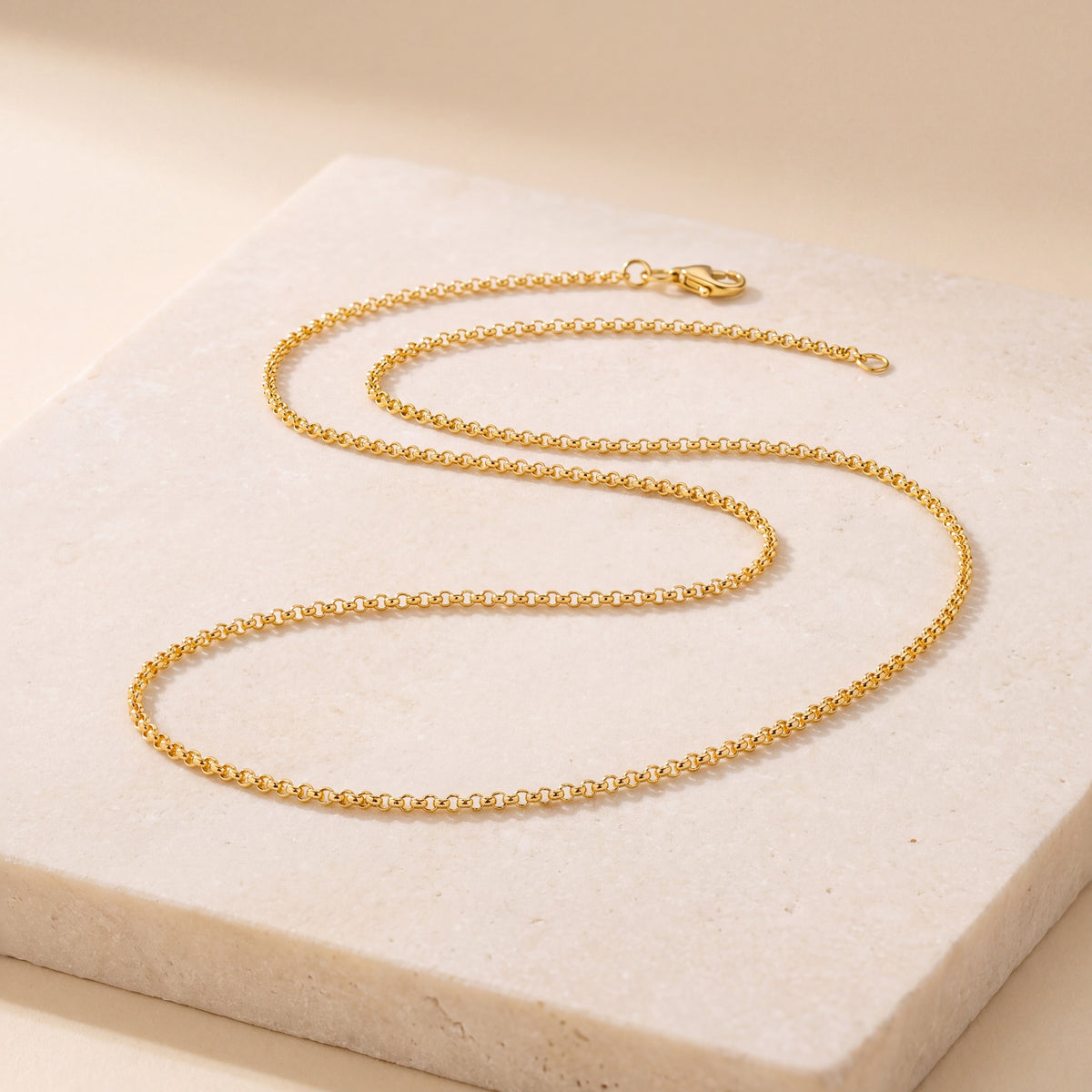 Double Round Link Chain 2 laid flat on travertine