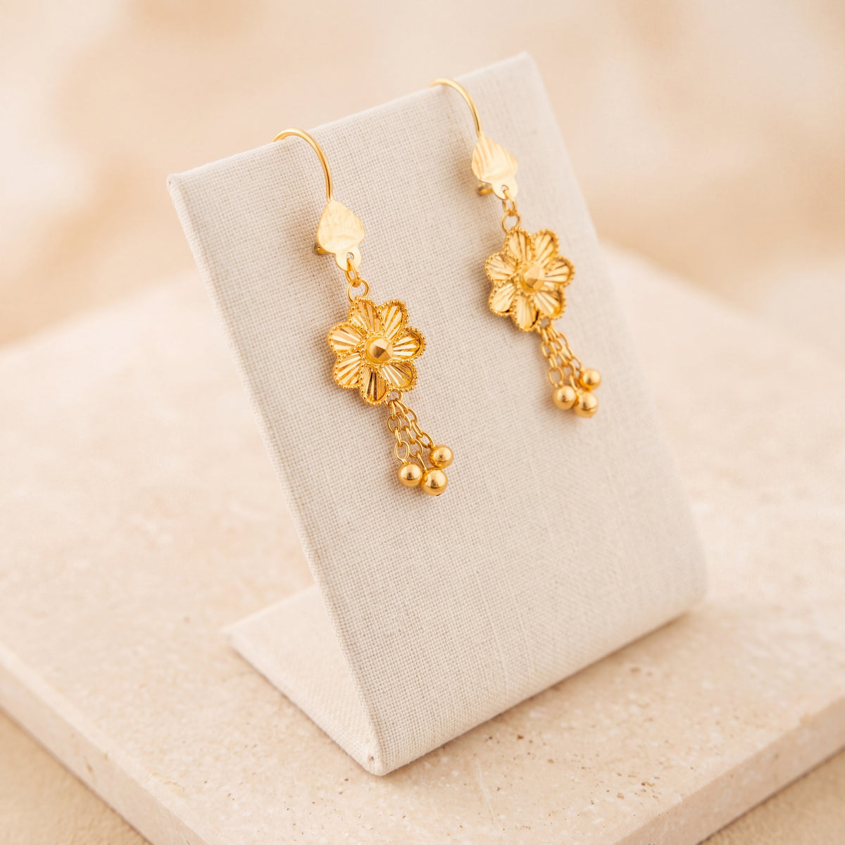 Flower Earrings 2 – With dangling beads, on travertine