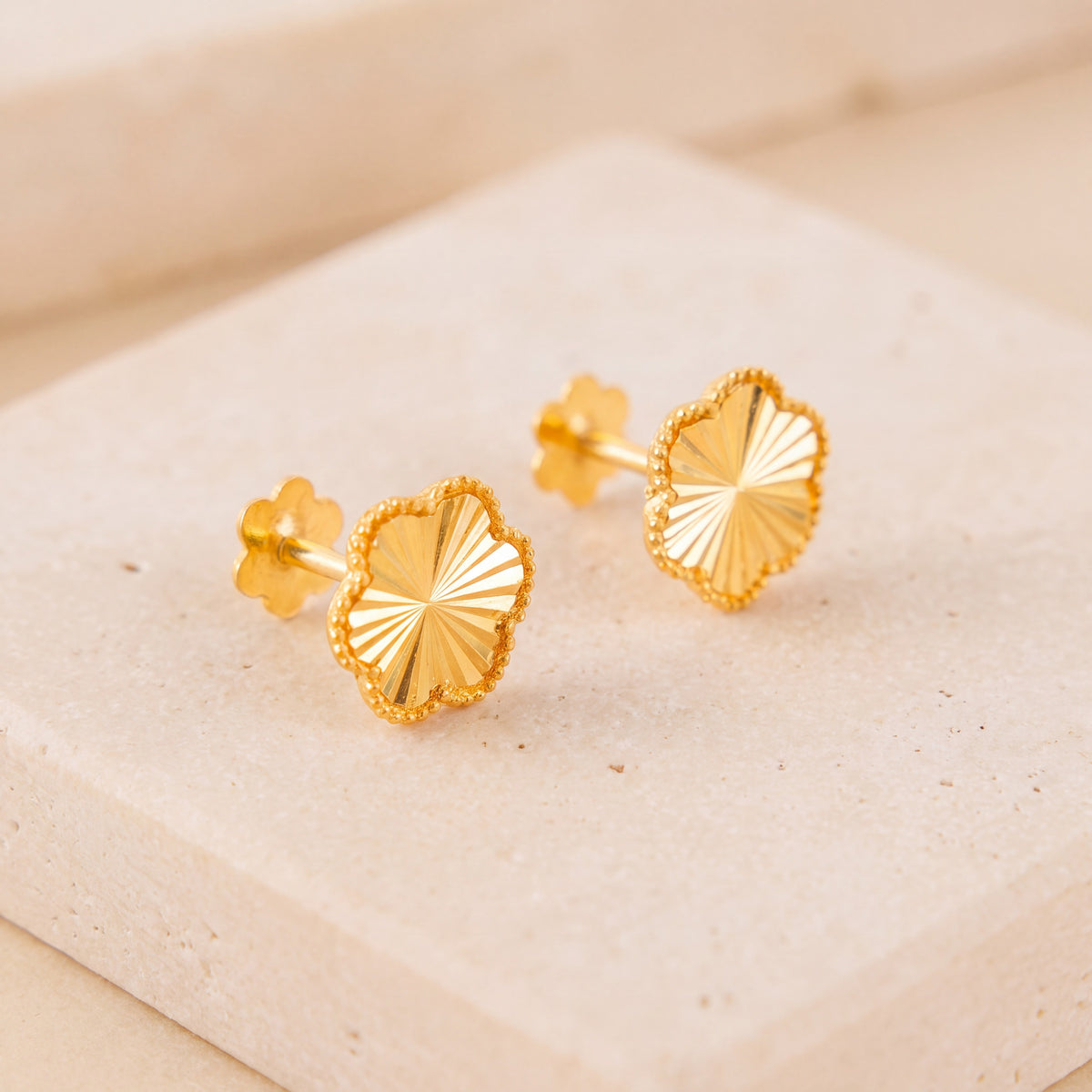Flower Stud Earrings 1 on travertine