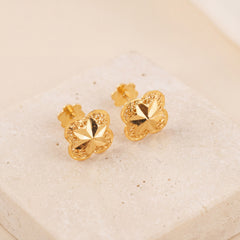 Four Petal Stud Earrings 1 on travertine