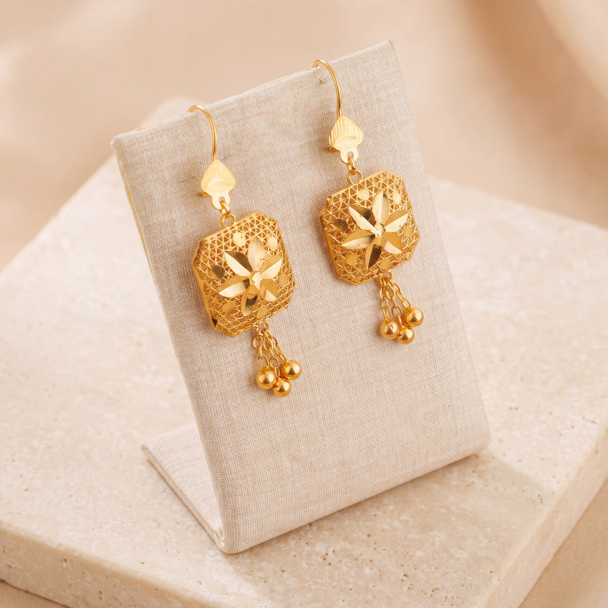 Frame Earrings 2 on travertine
