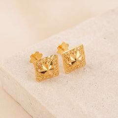 Frame Stud Earrings 2 on travertine