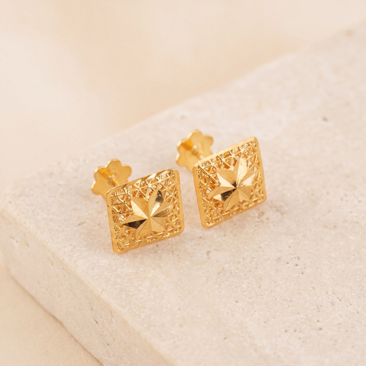 Frame Stud Earrings 2 on travertine