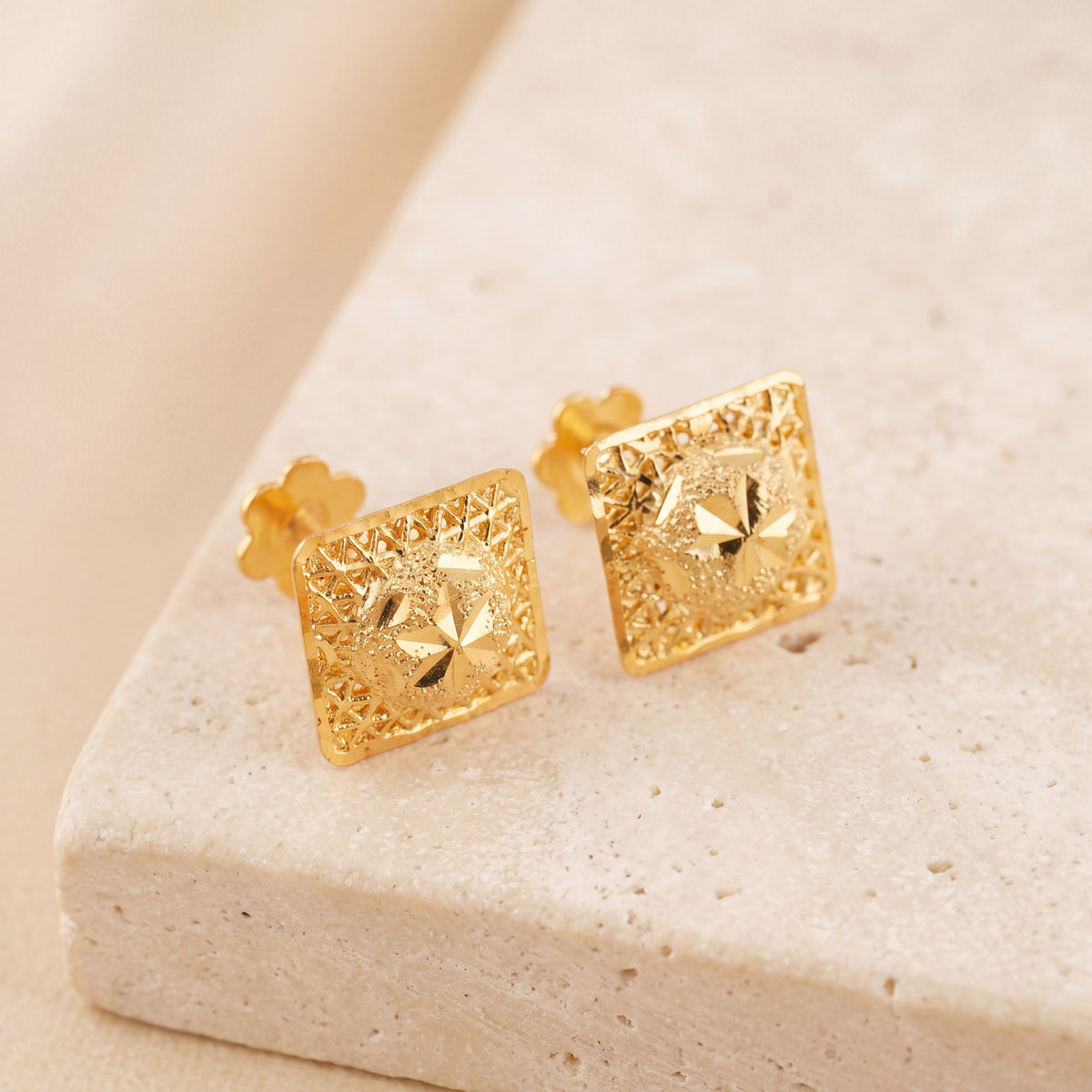 Frame Stud Earrings 3 on travertine