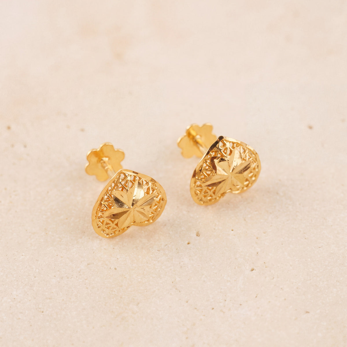 Heart Stud Earrings 2 on travertine