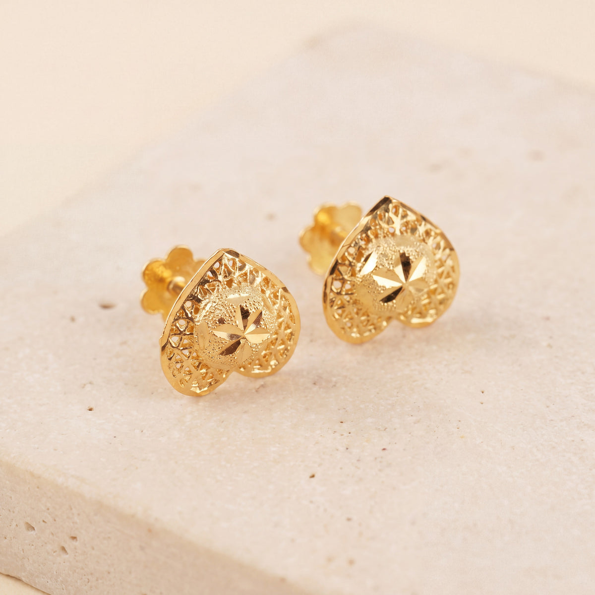 Heart Stud Earrings 3 on travertine