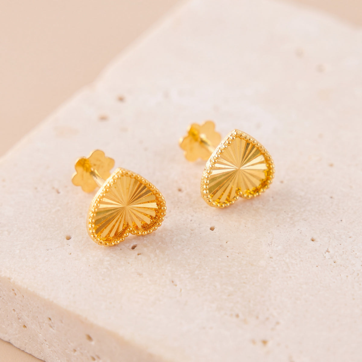 Heart Stud Earrings 5 on travertine