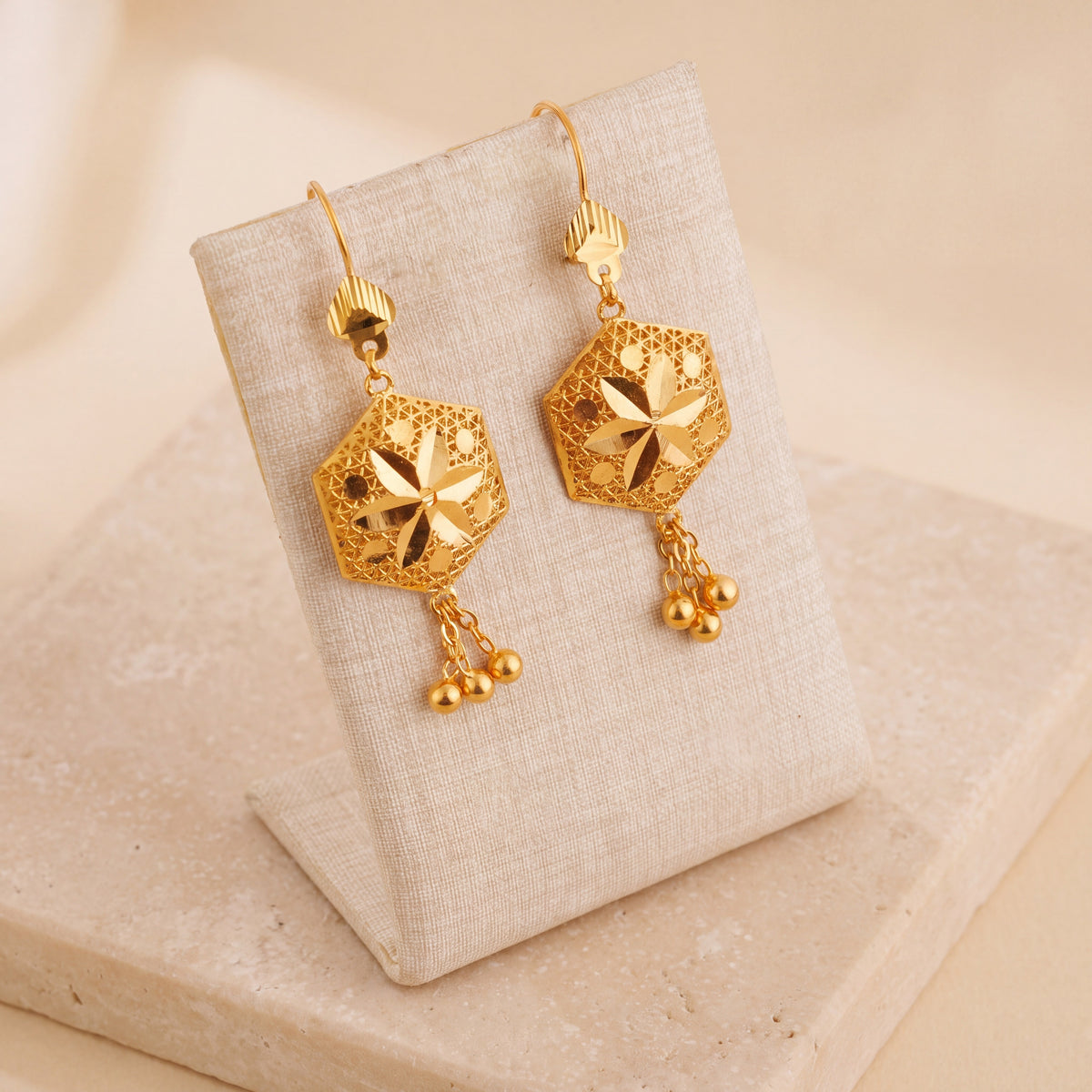 Hexa Earrings (D2) on travertine