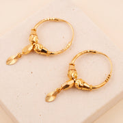 Hoop Earrings D24- (V1) on travertine