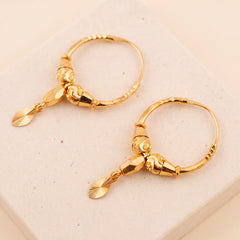 Hoop Earrings D24- (V1) on travertine