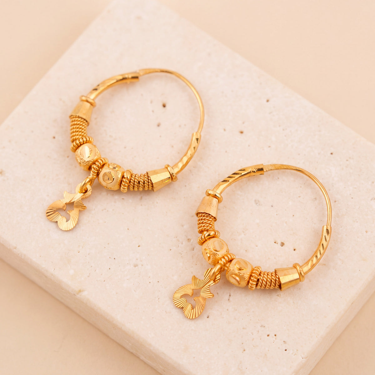 Hoop Earrings D26- (V1) on travertine
