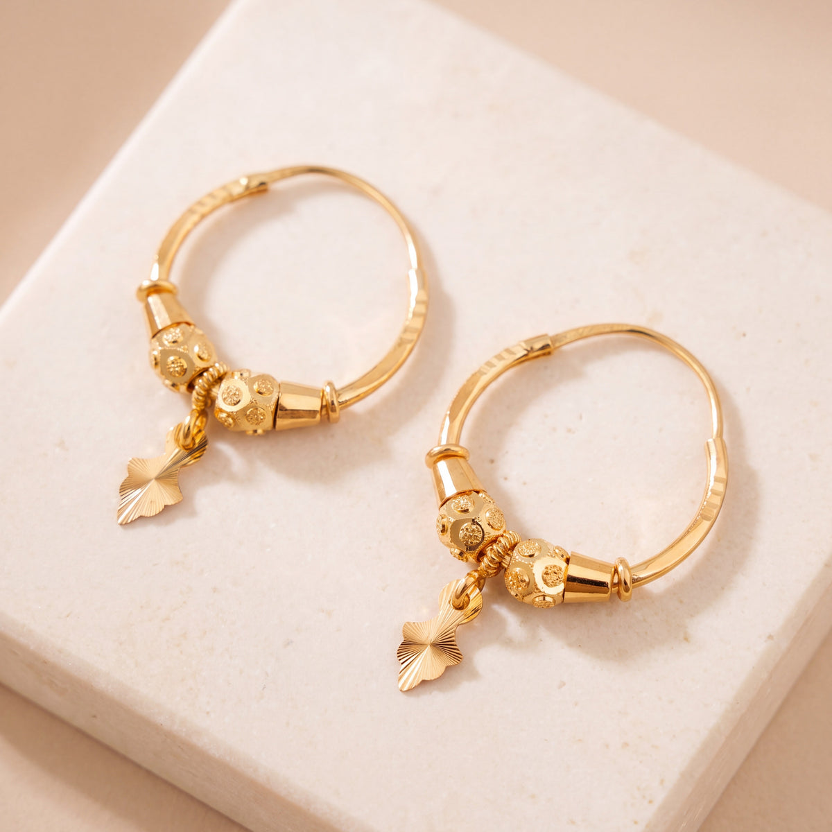 Hoop Earrings D28- (V1) on travertine