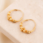 Hoop Earrings D31- (V1) on travertine