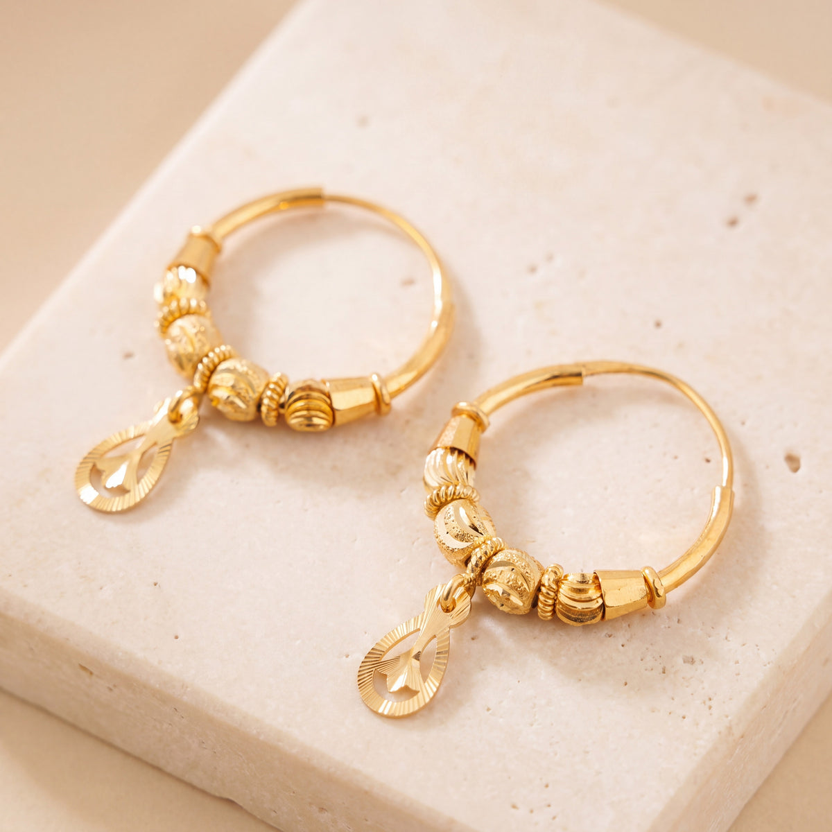 Hoop Earrings D36- (V1) on travertine