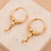 Hoop Earrings D37- (V1) on travertine