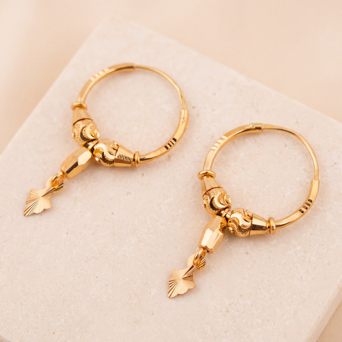 Hoop Earrings D38- (V1) on travertine